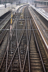 Empty railway station with rails, switches and overhead lines seen from above in Maastricht, the Netherlands