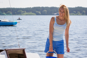 Cheerful young woman on a yacht