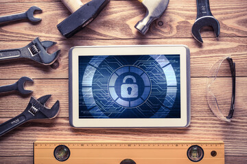 Web security and technology concept with tablet pc on wooden table © adam121