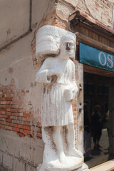 Campo dei Mori, venetian ancient medieval statue with iron nose , Cannaregio district of Venice
