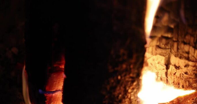 Burning smoldering wood and coals in fireplace 4k movie