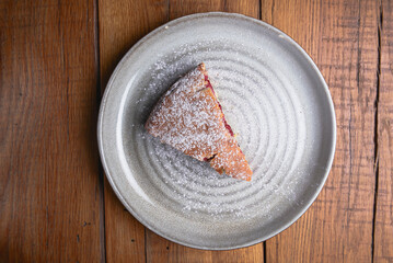 Homemade Organic Berry Pie with blueberries and blackberries, one piece of pie served on a plate.