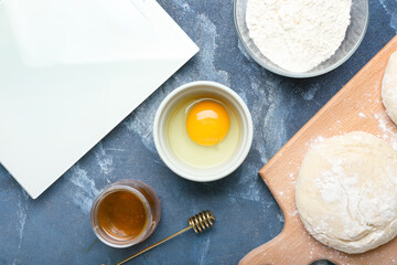 Ingredients for preparing bakery and utensils on color background