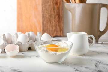 Ingredients for preparing bakery and utensils on light background