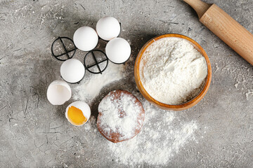 Ingredients for preparing bakery on grey background