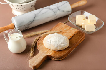 Ingredients for preparing bakery and utensils on color background
