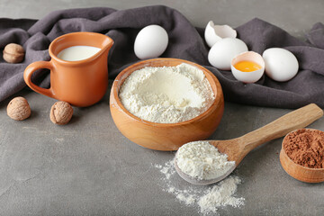 Ingredients for preparing bakery on grey background
