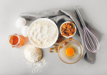 Ingredients for preparing bakery and utensils on light background