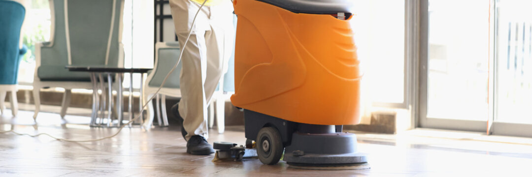 Man Is Cleaning Hotel Lobby With Industrial Vacuum Cleaner