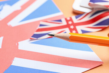 Pencil and UK flag, closeup. Concept of learning English