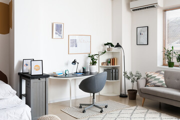 Interior of stylish room with modern workplace