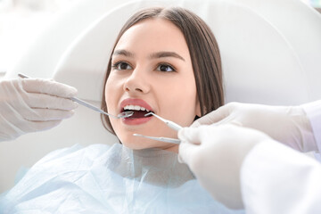 Young woman visiting dentist in clinic, closeup