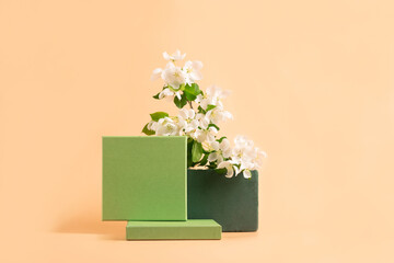Modern abstract podium green paper geometric shapes white flowers pastel pink background. Copy...