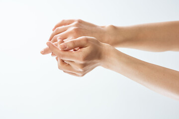 hands cream massage skin care close-up health light background