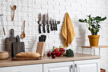 Counter with food and utensils in kitchen