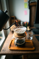 drip coffee in house,Pouring a hot water over a drip coffee