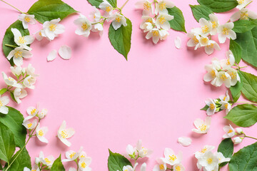 Frame made of beautiful jasmine flowers on color background