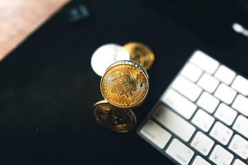 Bitcoin coins on a wooden desk