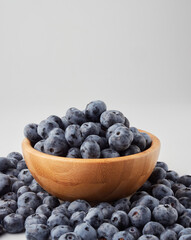 Blueberry fruit top view isolated on a white background, flat lay overhead layout with mint leaf, healthy design concept.