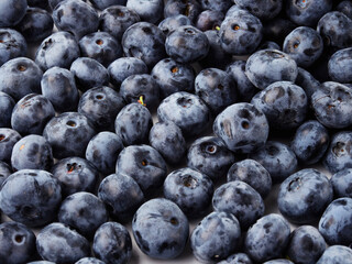 Blueberry fruit top view isolated on a white background, flat lay overhead layout with mint leaf, healthy design concept.