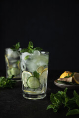 Detox Sassy Water. Cool and fresh drink with lemon, cucumber, mint, ginger and ice. Two glasses of...
