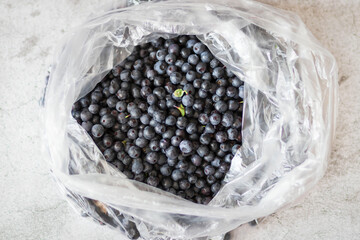 Blueberries on the table. Berries in bowls and in a jar.