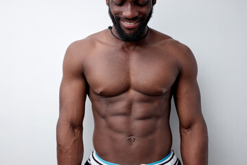 Cropped photo of strong muscular black man with naked torso, bodybuilder concept. african american sportsman having strong abdominal abs. Close-up portrait, copy space. people, workout, sport