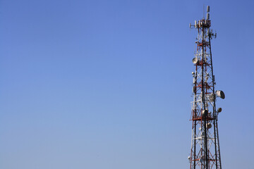Blue sky and  telecommunication tower. Antenna transmitter for wireless communication: 3G, 4G, 5G
