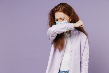 Sick ill young redhead curly woman 20s wears white T-shirt violet jacket sterile face mask ppe to...