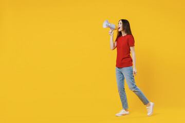 Full size body length charming fun satisfied young brunette woman 20s wears basic red t-shirt hold...