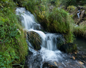 Fototapeta premium Rocks and cascades on wild stream Krupa on popular picnic place Krupa na Vrbasu near Banja Luka, Bosnia and Herzegovina