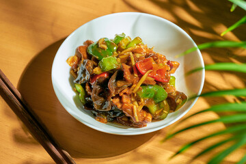 Vegetables and shiitake mushrooms in sweet and sour sauce. Chinese cuisine.