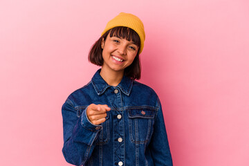 Young mixed race woman isolated on pink background cheerful smiles pointing to front.
