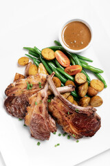 australian organic lamb chops with gravy meal on white backgroundv