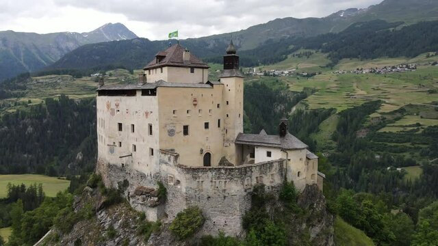 Drone view at Tarasp castle on the Swiss alps
