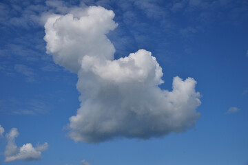 Cumulus clouds on clear sunny day as background