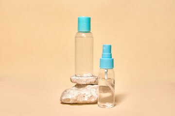 Cosmetics container on the pastel background. Natural stones. Earth colors, zero waste containers. Mockup concept. Copy space for text or design. Can be used as advert banner.