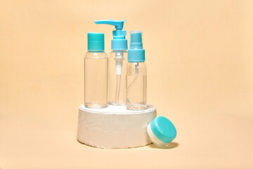 Cosmetics container on the pastel background. Earth colors, zero waste containers. Mockup concept. Minimal boxes and geometric podium. Scene with geometrical forms. 