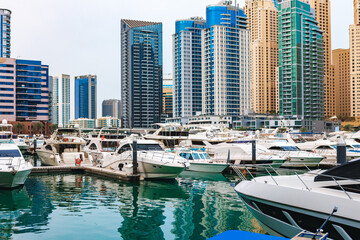 Fototapeta na wymiar Dubai Marina skyscrapers and port in Dubai, United Arab Emirates