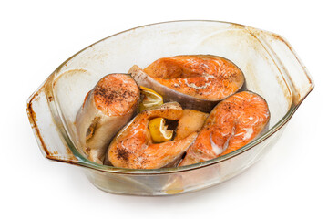 Baked pieces of rainbow trout in glass baking dish