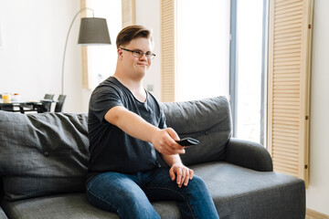 Smiling white young man with down syndrome