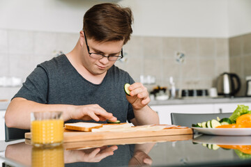 Smiling white young man with down syndrome