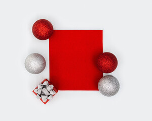 Happy holidays, Merry Christmas, New Year concept. Bright pattern with shiny red and silver Christmas balls and small gift box