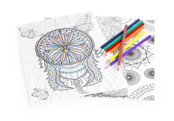 Antistress coloring pages and pencils on white background