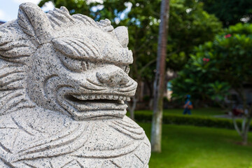 Stone lion sculpture, City park sculpture.