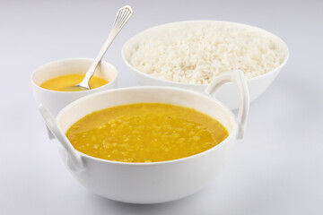 Indian staple food everyday meal Dal Rice or yellow lentil soup with white rice and ghee