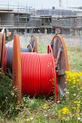 Huge spools  with  cables for the construction industry to connect new built houses