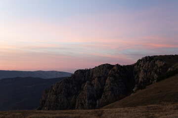 Evening mountain landscape, sunset pink-purple sky of Demerdzhi.