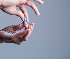 Woman hand holding pills. Pills. Background. Medicine. Background. Hand. 