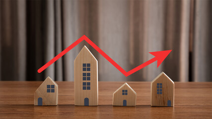 Close up of house model with red arrow pointing up same as step stair go up. concept real estate or property values growth up, Housing price increasing or rising market, investment buying and selling.
